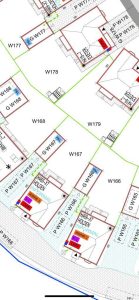 Architectural site layout plan showing residential housing plot layouts, boundaries, and groundworks engineering details