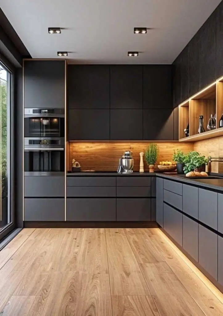 Modern matte black kitchen renovation with integrated LED lighting and wood accents in Northampton
