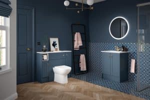 Luxury modern navy blue bathroom renovation in Northampton with LED round mirror and patterned tiles