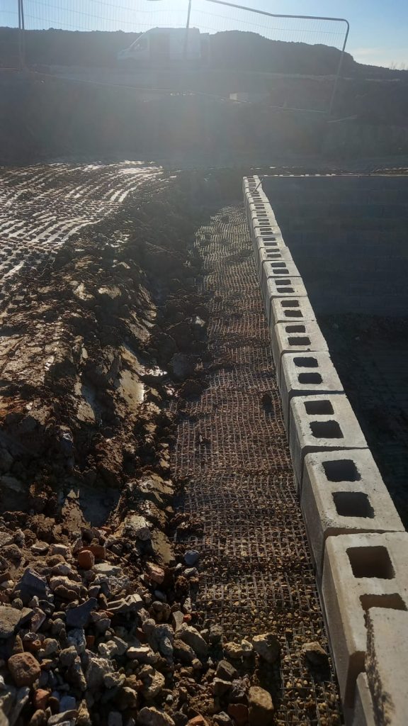 Allan Block retaining wall construction with geogrid reinforcement in Wellingborough